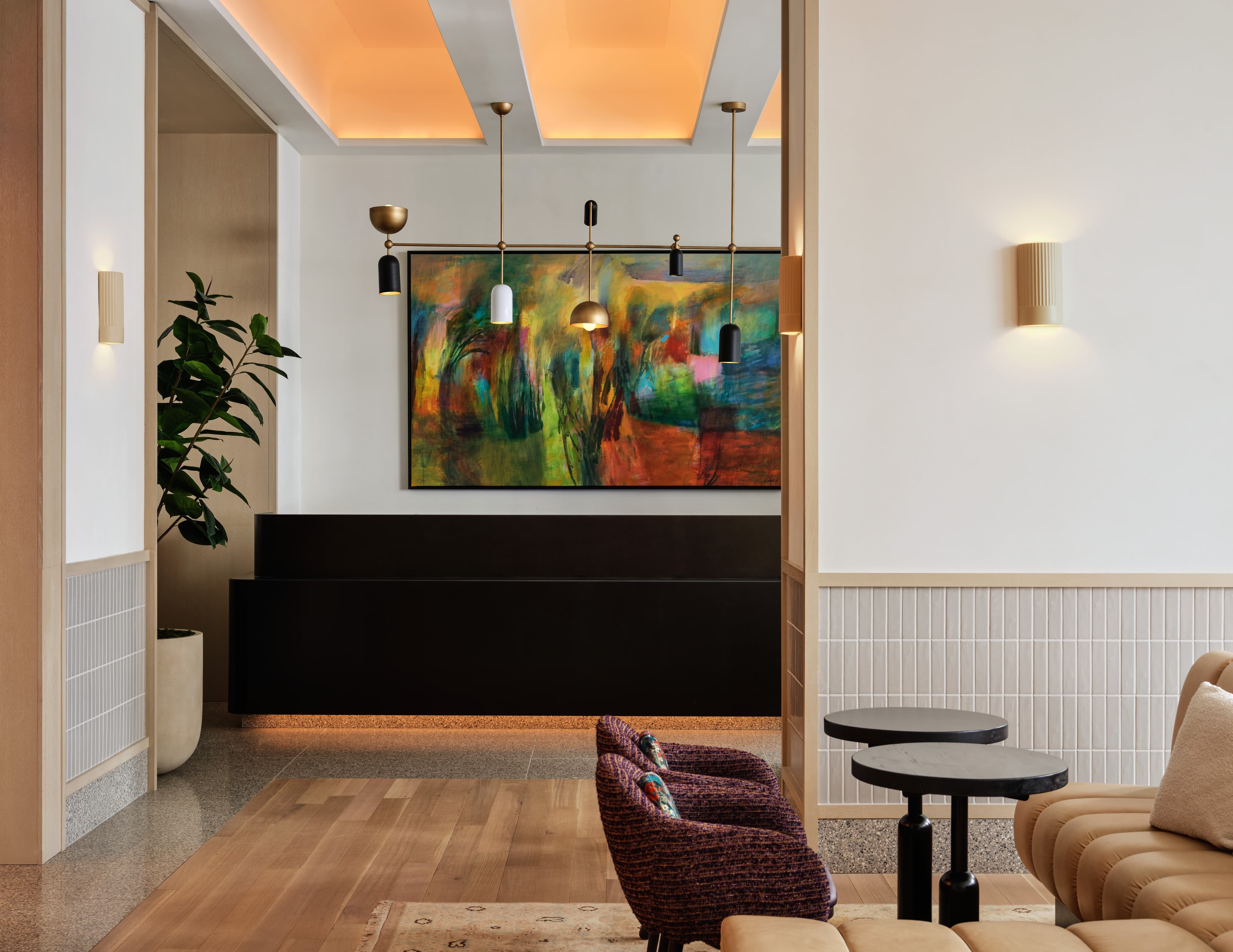The Parlor lounge seating area with artwork and tables